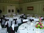 White Chair Covers and Chocolate Taffeta Sash